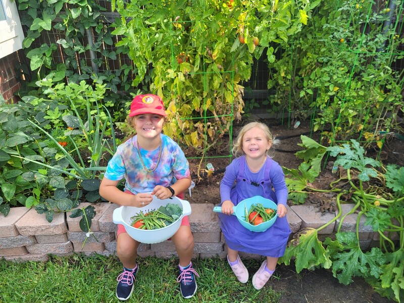 garden pickers back in Texas. They are showing off their harvest.