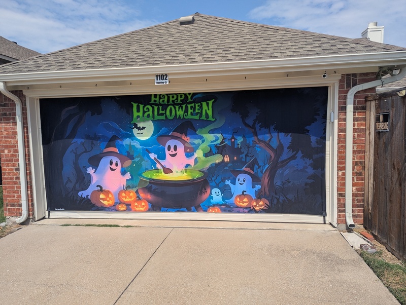 We installed our Halloween garage cover and invited families and groups to take their pictures in front of it.