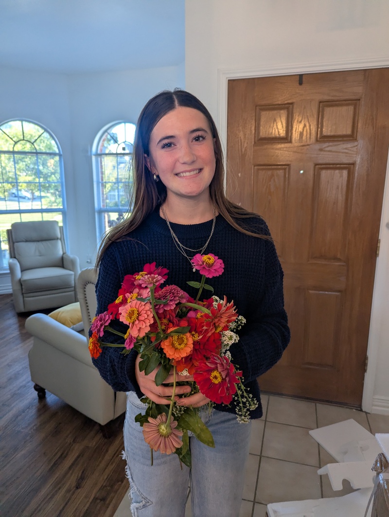 Some friends came and picked zinnias for a girl that likes them.