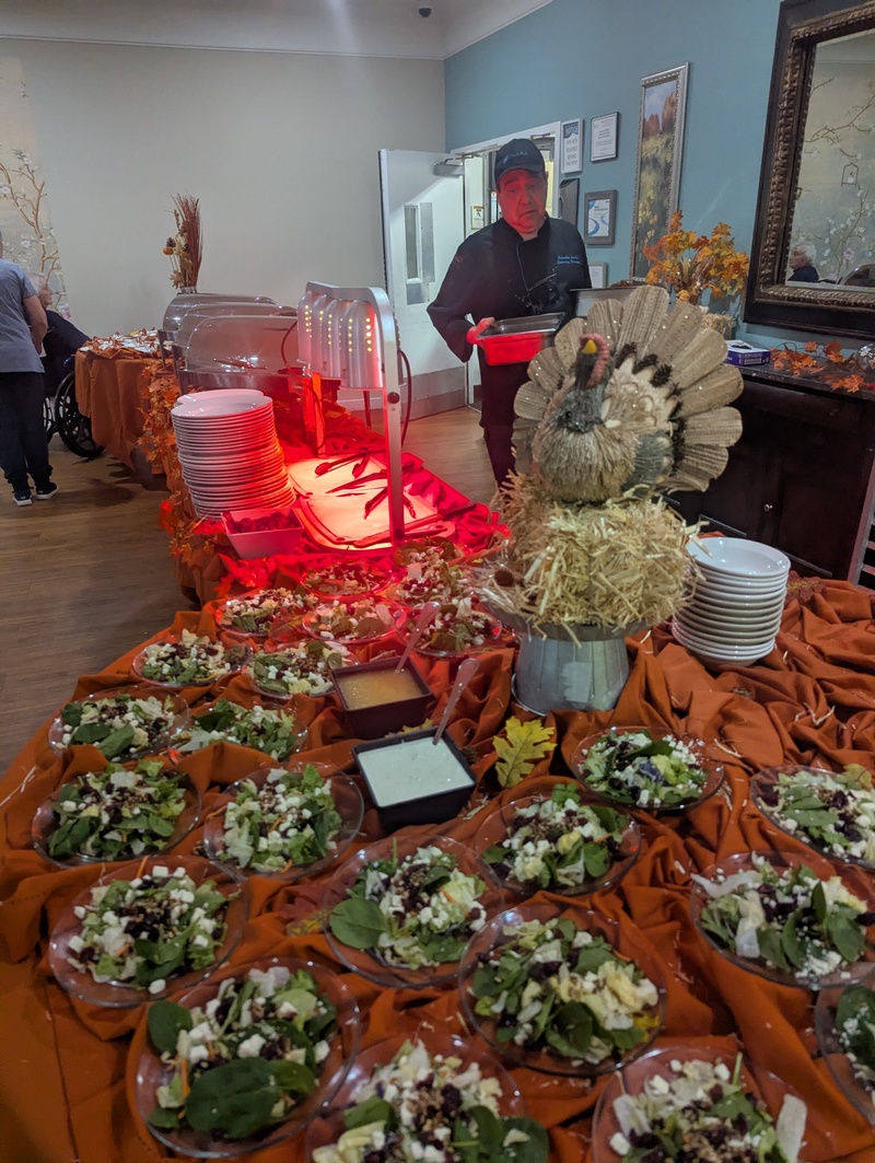 The staff setting up Thanksgiving dinner.