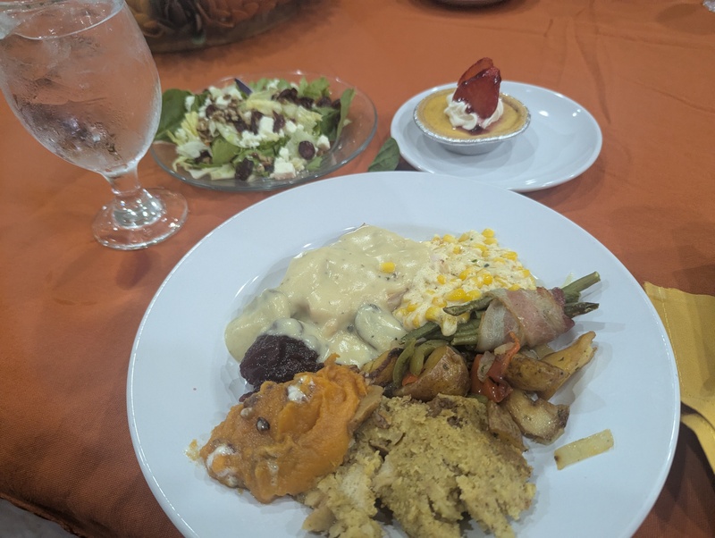 My dinner. The sauce that was with the corn was very yummy. I liked it. I thought the green beans was asparagus. I guess I am getting blind. The stuffing was corn instead of bread. I guess I am in Texas. It was all yummy though. The turkey was really delicious with mushroom sauce on top that had sliced mushrooms in it. It was very good.