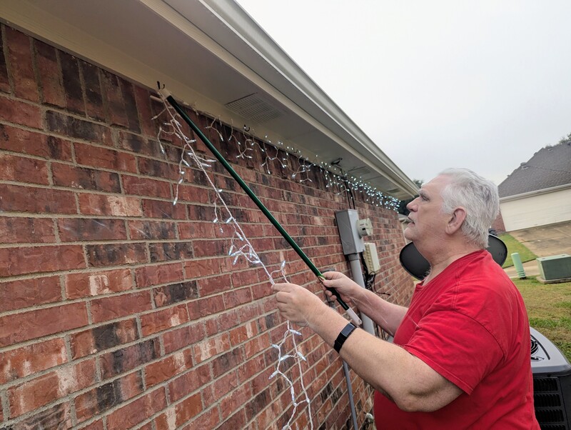 Don putting up Christmas lights.