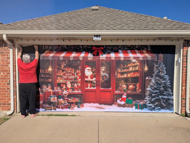Don working on the Christmas garage cover.