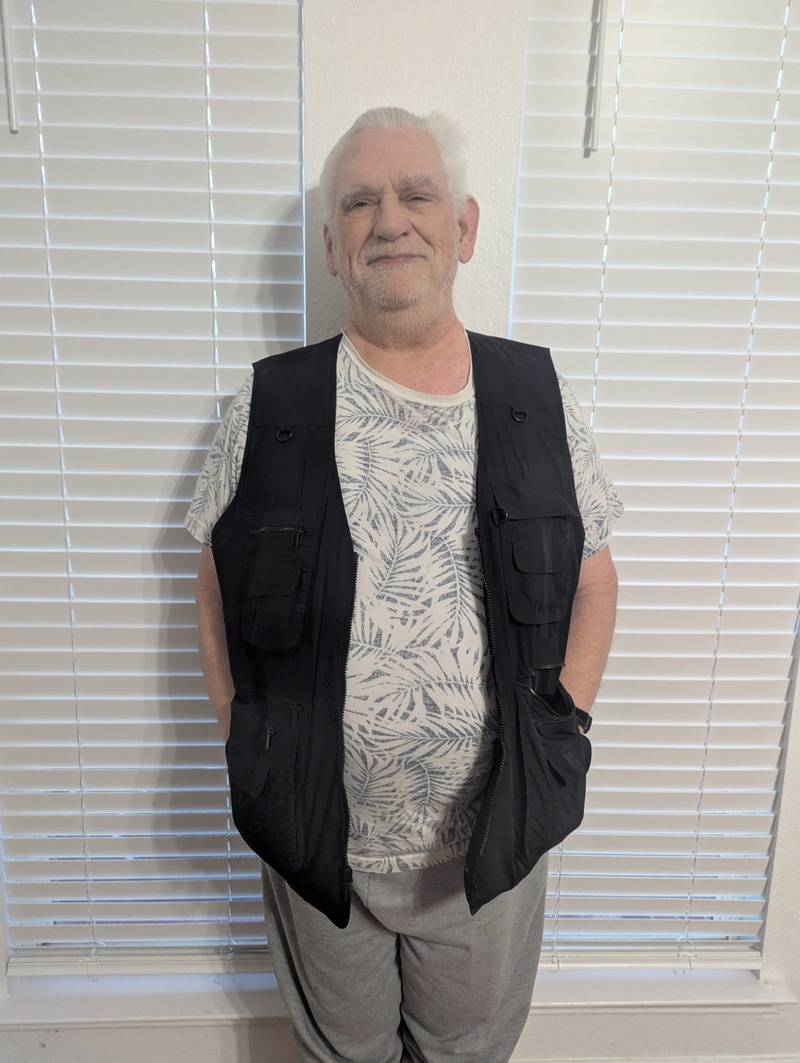 Don enjoys his new man-purse (vest). Cell phone, ear buds, car keys, wallet, meds, glasses, pen and paper, cough drops, and a place for trash. Awesome! And all in a stylish black fabric.