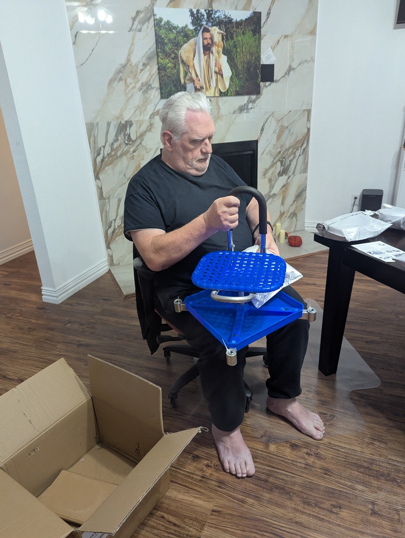 Don assembling Lois's new wheels.