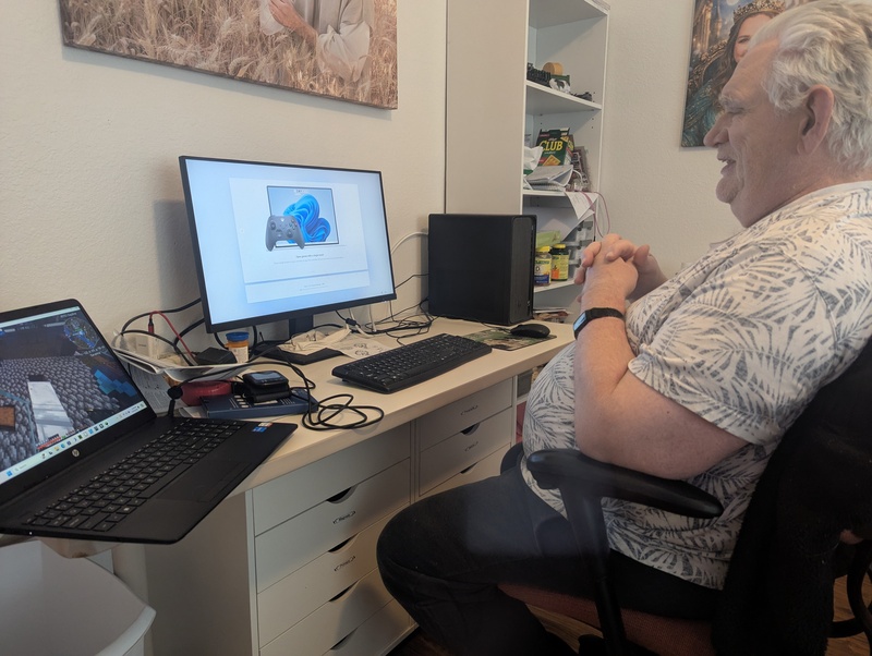 Don sets up Lois's new computer. Minecraft is running nearby.