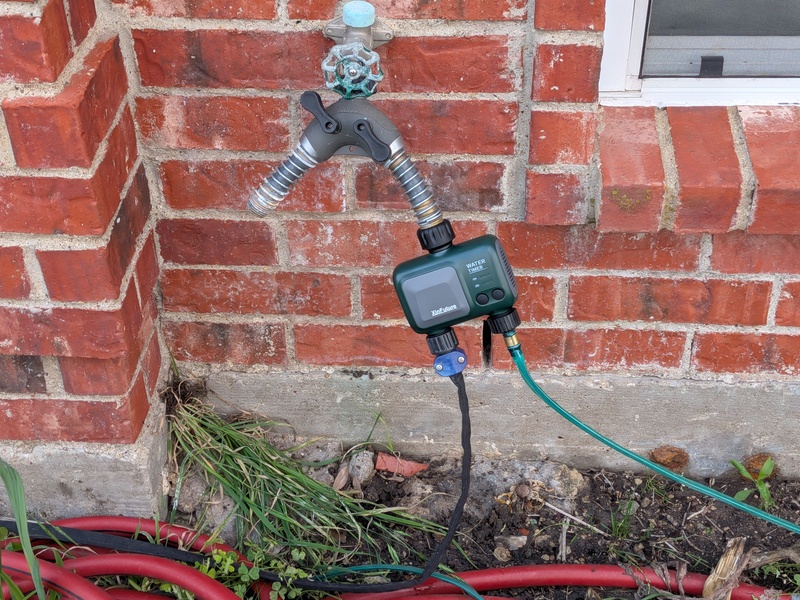 new water timer hooked up to hoses.