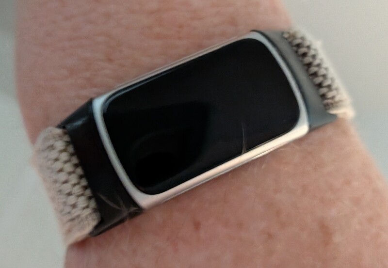 Lois's new Fitbit and her old band.