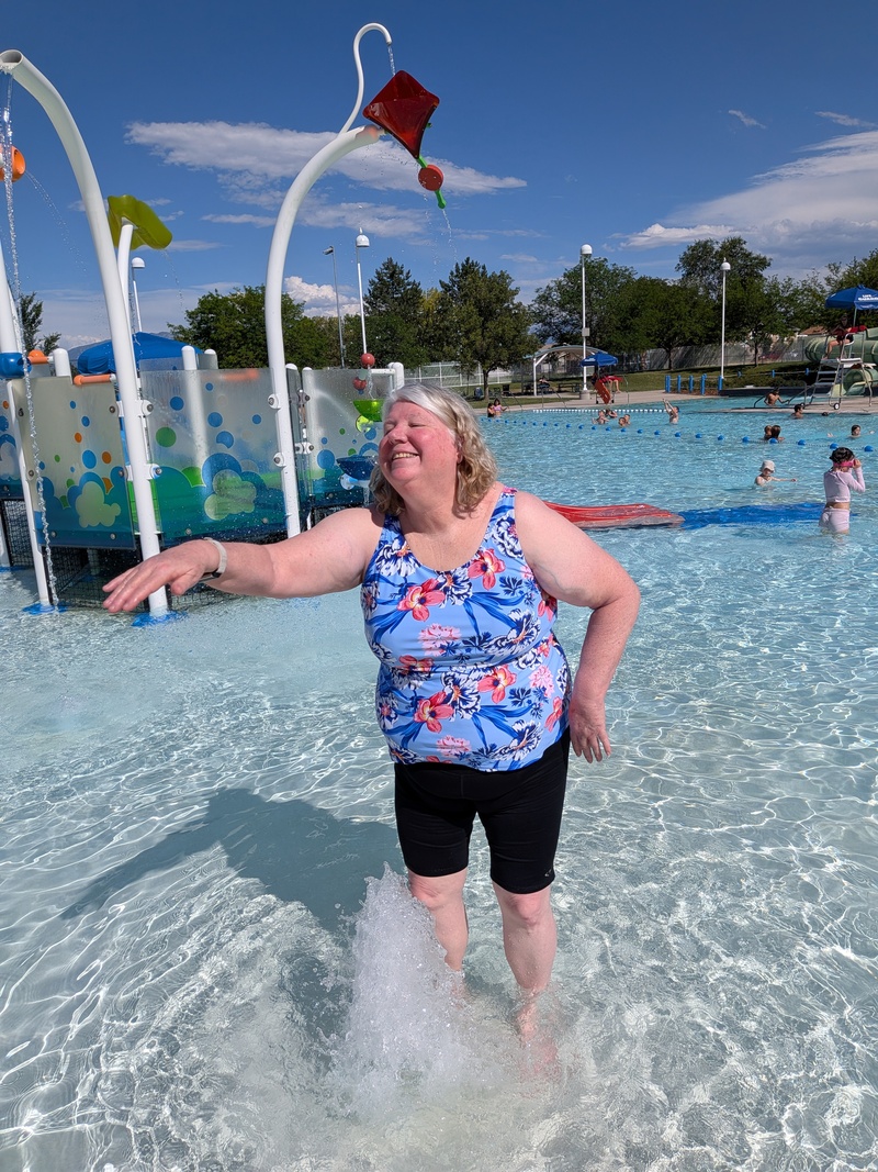 Lois swimming in the shallow end.