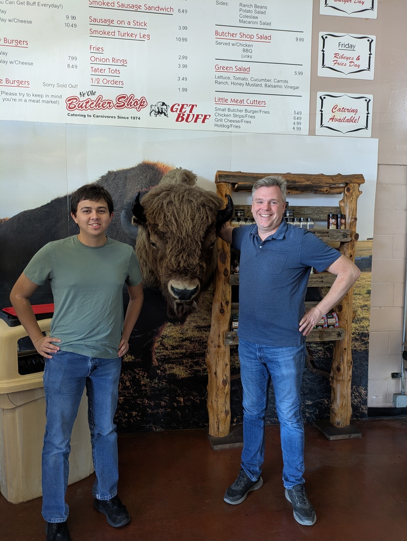 Alex and Joseph with the Buffalo at Ye Olde Butcher Shoppe.