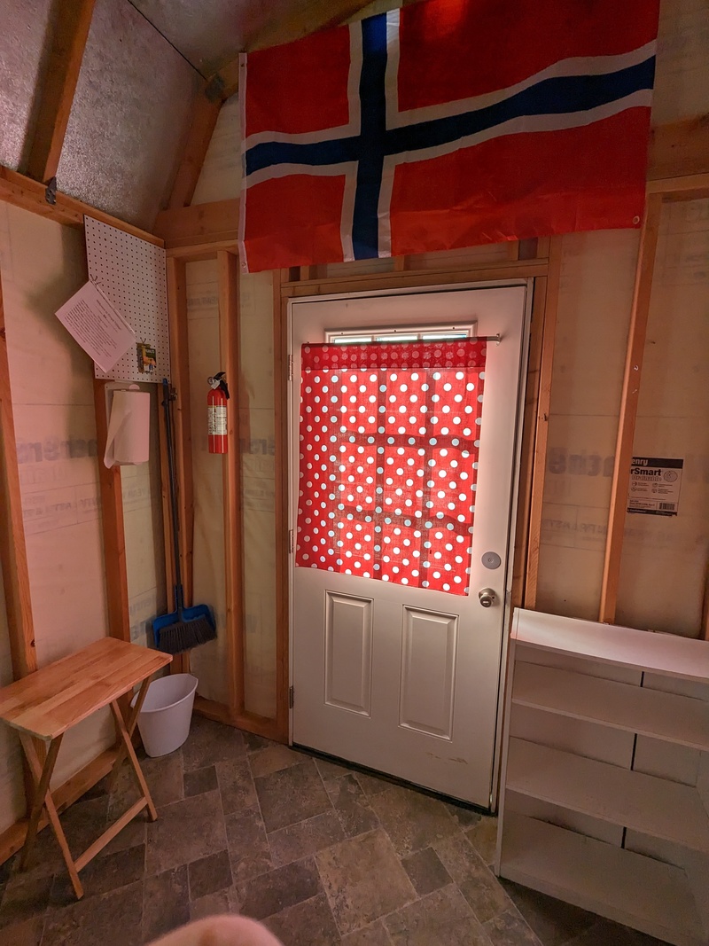 B4 Flag of Norway hangs inside honoring our relatives.  Service items in the corner.