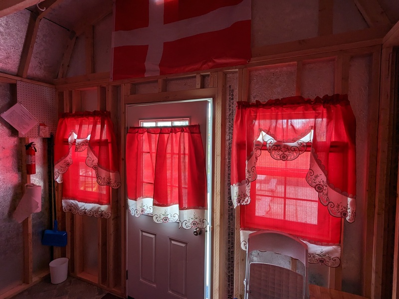 LIGHTEN B7 Flag of Denmark honors our Danish relatives; window treatments provide a bit of privacy. Service items in the corner.
